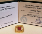 Złota odznaka "Zasłuzony Działkowiec"